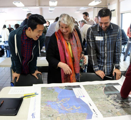 Workshop participants discussing CoSMos map results for Long Beach (map 2).