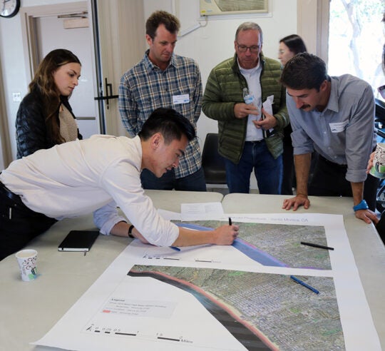 Workshop participants discussing CoSMos map results for Santa Monica (map 1).