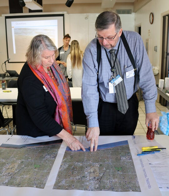 Workshop participants discussing CoSMos map results for the South Bay (map 1).