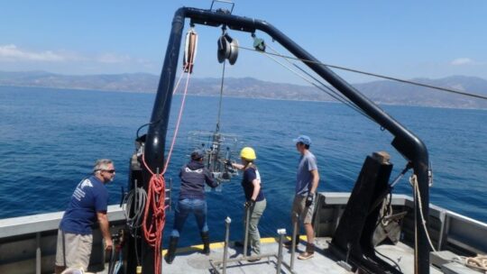 Researchers on a vessel off the coastline of Malibu.