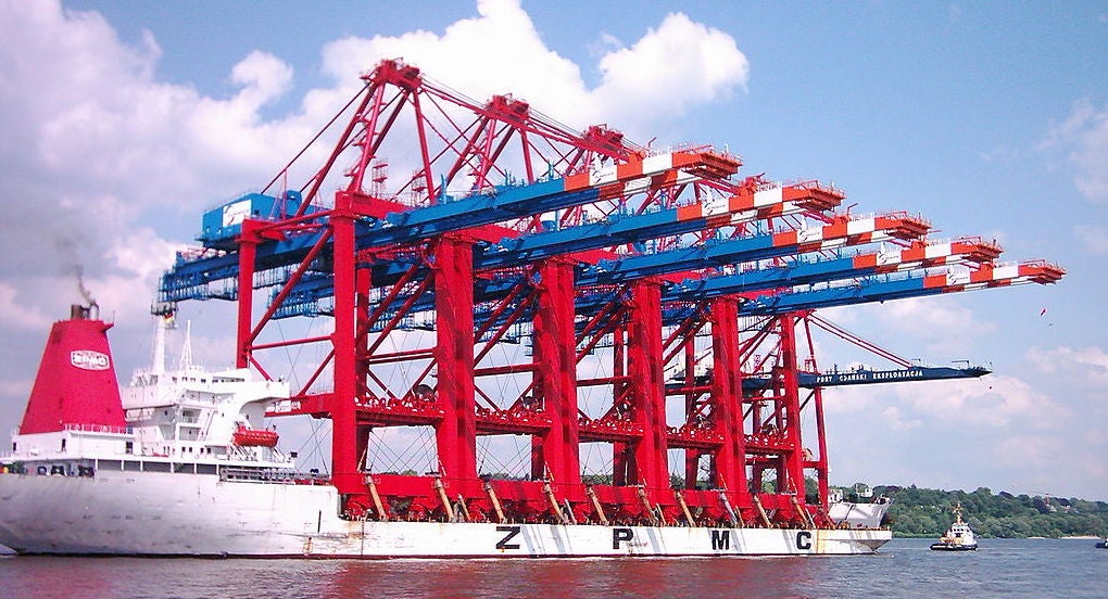 Transport of five gantry cranes for Eurogate Container-Terminal in Hamburg. Elbe, Finkenwerder, Germany.