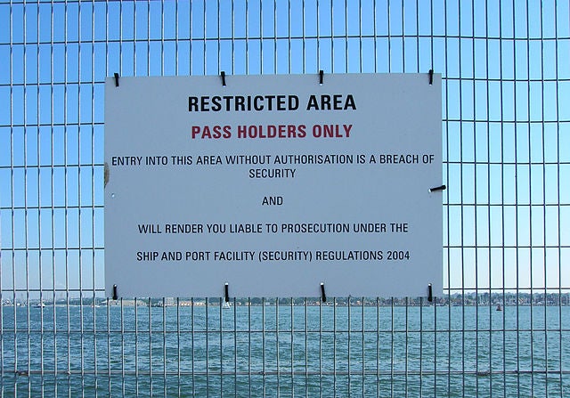 An ISPS Code being applied in Southampton, UK with signs prohibiting access to areas next to ships; taken in 2006.