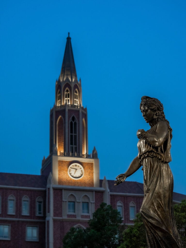 Image of Hecuba statue in the University Village courtyard in the early morning.