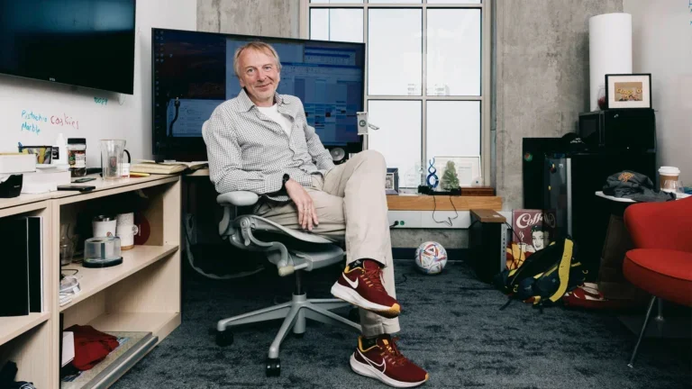 Professor Peter Kuhn sits in his office.