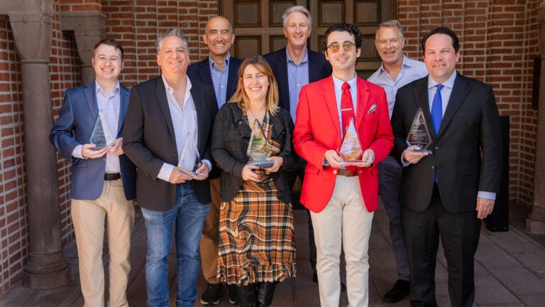 Front, from right: Winning public scholars Anthony Vaccaro, Vahe Peroomian, Darby Saxbe, Miguel Híjar-Chiapa, and Christian Grose. Back, from right: USC Dornsife Interim Dean Moh El-Naggar, Executive Vice Dean Stephen Bradforth, and Senior Associate Dean for Communication and Marketing Jim Key.