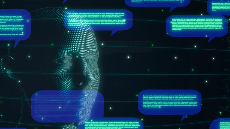 Image of a pixelated face representing artificial intelligence with dialog bubbles.