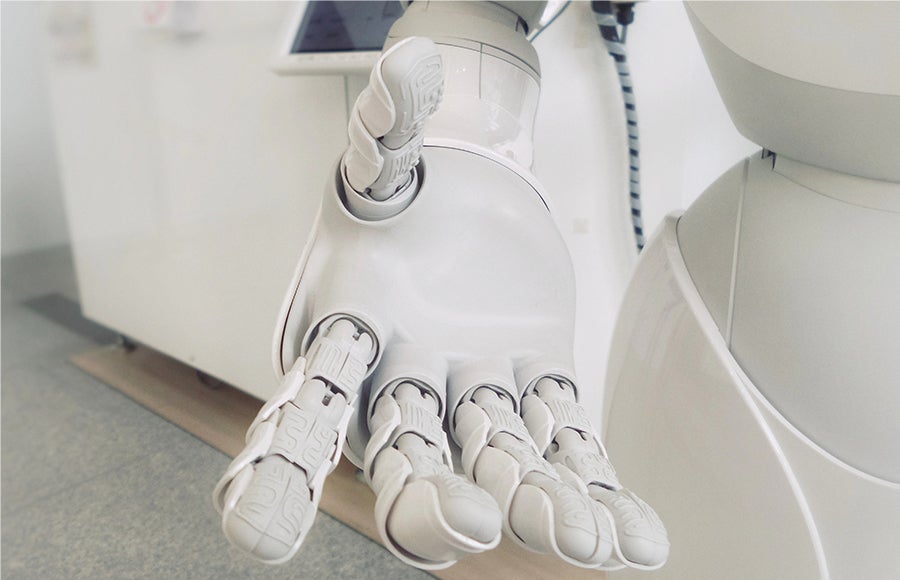 A photo of a white robotic hand.