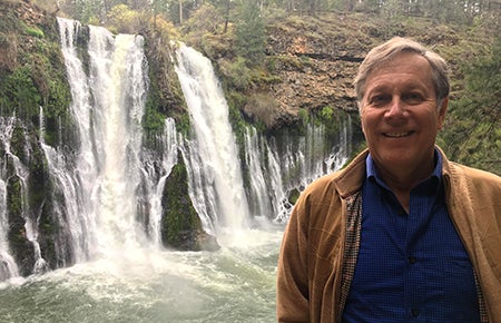 Photo of Dana Gioia in front of water fall