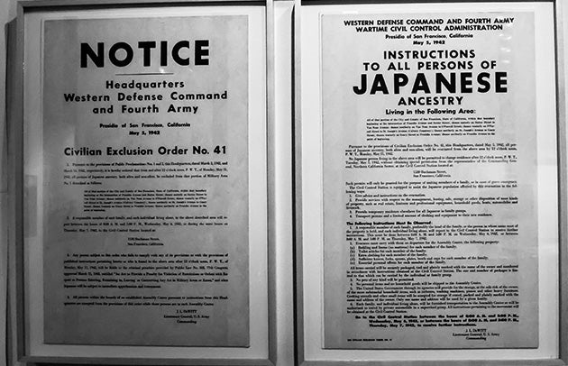 Black and white photo of two framed documents of Executive Order 9066