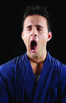 Picture of man in robe yawning