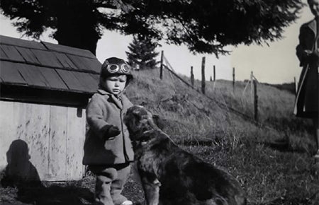 Photo of Michael Waterman as a toddler with dog