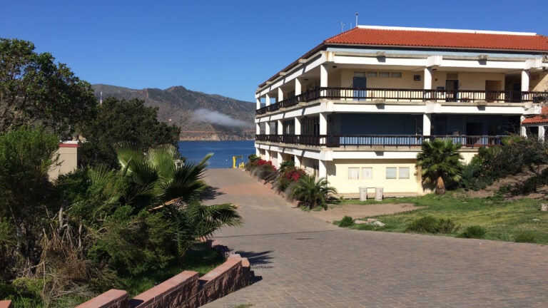 the WMSC lab building, a three-story building encircled by outdoor breezeways and topped with a red tile roof